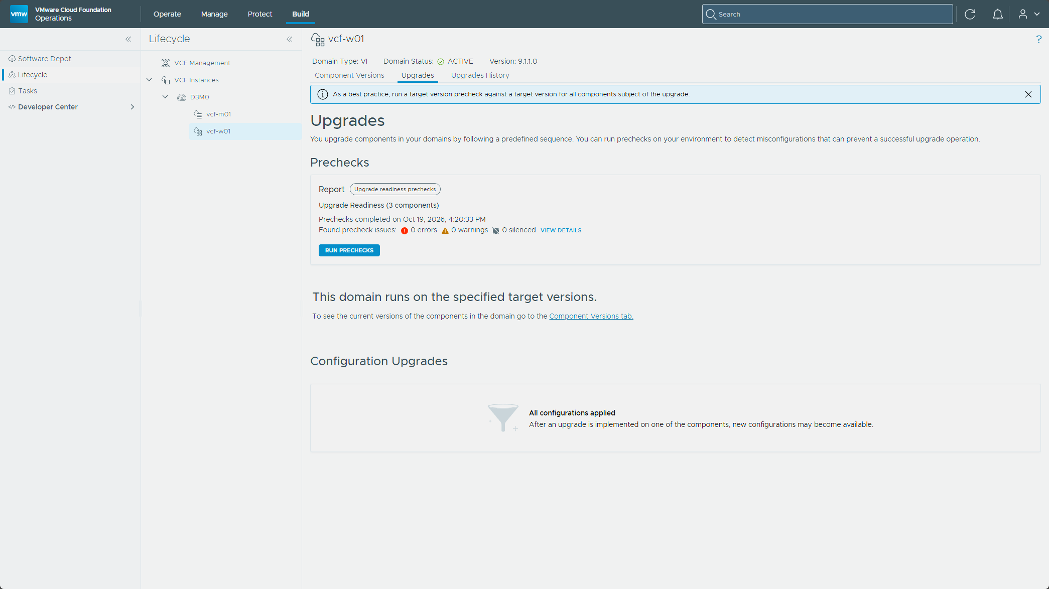 The vcf-w01 Upgrades tab reporting the domain runs on the specified target versions
